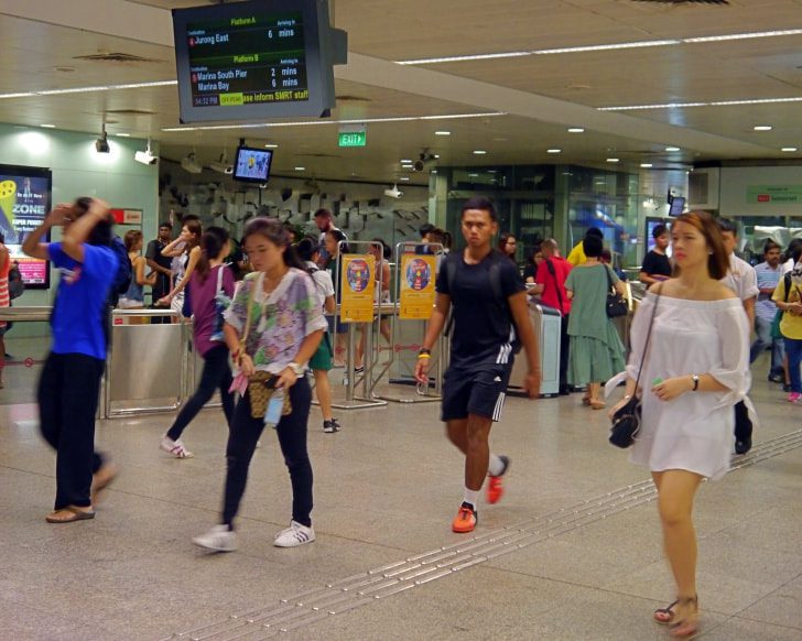Singaporeans taking the MRT during the rush hour. Photo: Khalil Realtor.